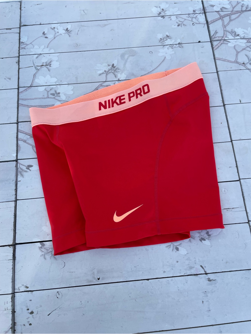 Nike Pro Women's Red Athletic Shorts with Peach Waistband